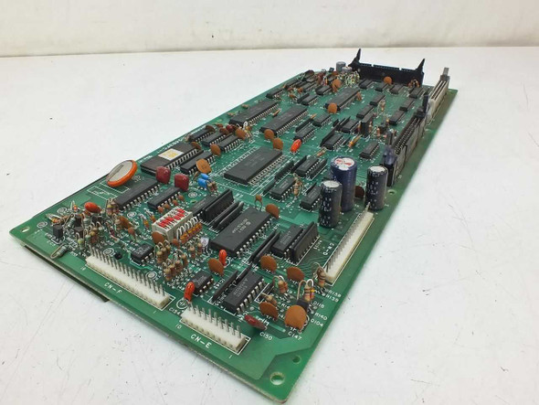 Sharp N0483FC-1 I/O Card — angled top view showing component side with DIP ICs, capacitors, and CN-E connector header