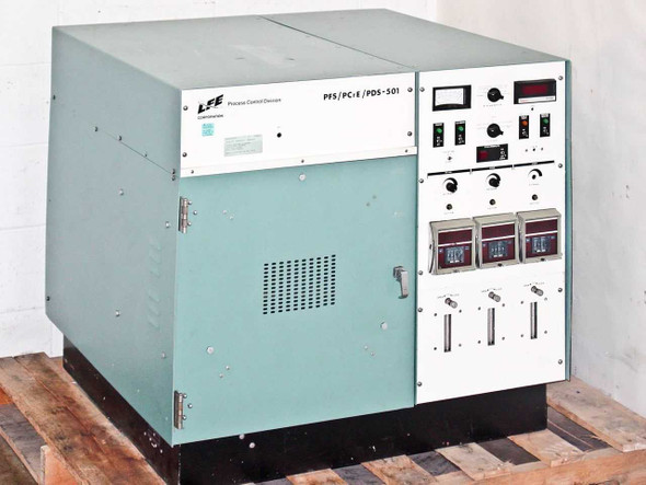 LFE Corporation PFS/PCrE/PDS-501 ICP barrel plasma etch system — full right-front view showing teal cabinet with control panel on right side, sitting on a wooden pallet