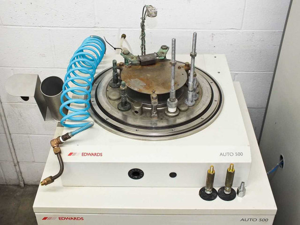 BOC Edwards Auto 500 chamber unit top view showing base plate with source posts, hardware, and blue coiled pneumatic tubing