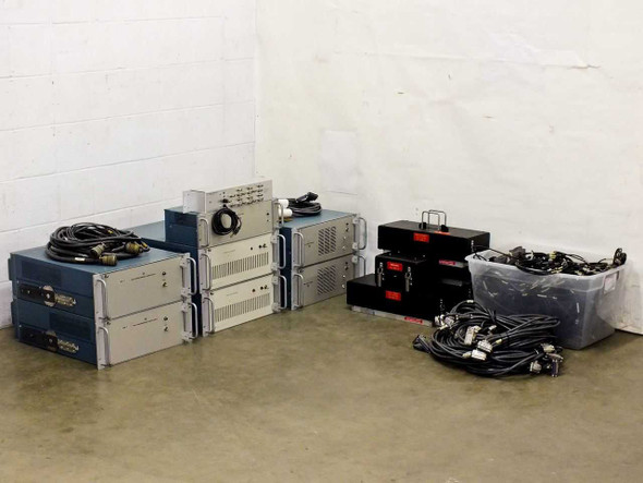 Tektronix 1140A HNVS Programmable Power Supply Test System full lot overview — all components laid out on floor including rackmount units, HNVS test fixture assemblies, and cable bin