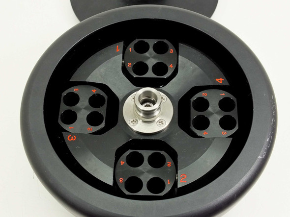 Tomy TMS-4 centrifuge rotor interior showing 4 swing buckets each with 4 tube positions numbered in red, stainless hub