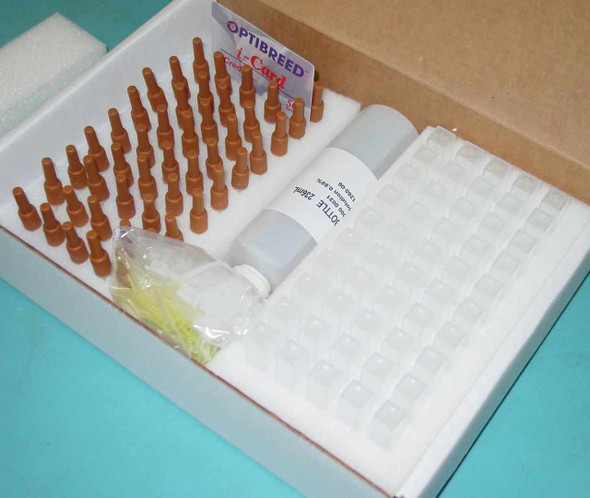 Optibreed i-Card label visible in kit box with amber vials arranged in foam tray, reagent bottles, and bagged accessories — top-down view of complete kit contents