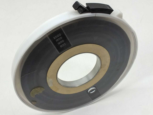 9-Track 1/2-inch magnetic tape reel in Wright Line white plastic canister – angled front view showing tape wound on reel with footage markings 800, 1200, 1600, 2000