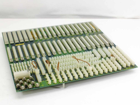 Netstal 110.240.9696 Komplett I/O backplane system board — front face showing dense array of white multi-pin edge connectors and Molex power connectors