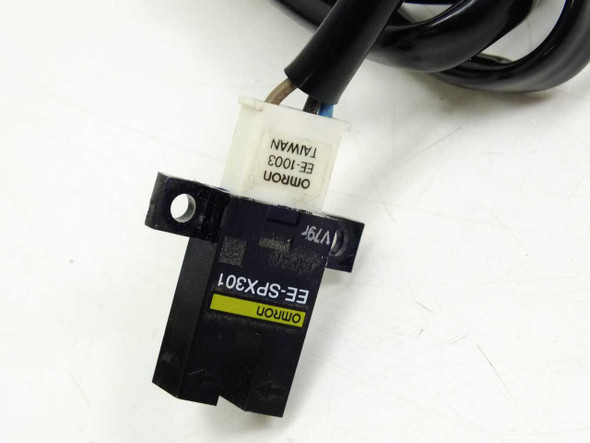 Omron EE-SPX301 sensor body close-up showing yellow model label and Omron EE-1003 Taiwan connector label