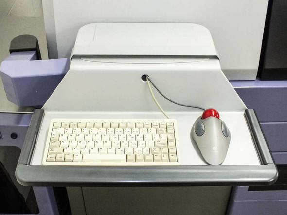 Camtek Falcon PD – operator console with compact keyboard and trackball mouse on sliding tray