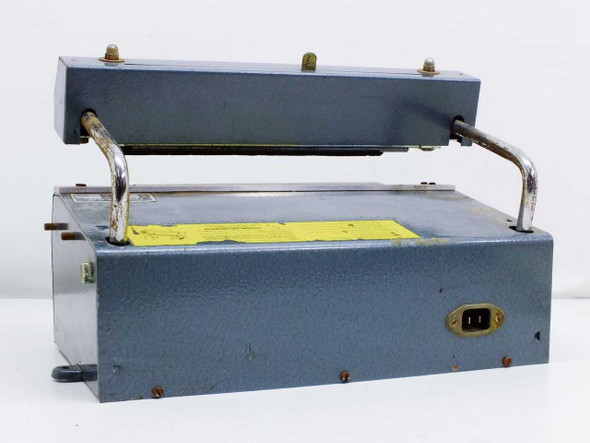 Audion Elektro SSM 230 heat sealer – rear view showing yellow warning label, IEC power inlet, and open sealing arm