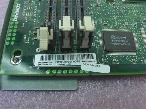 Compaq 296682-001 motherboard PCB rear showing part number label, SIMM slots, and Winbond W25P022AD-6 chip