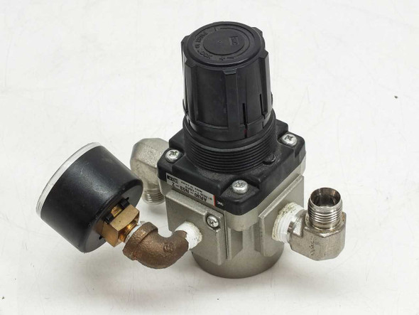 SMC AR30-N03-Z pneumatic regulator rear-left view showing gauge, body, and brass elbow fitting
