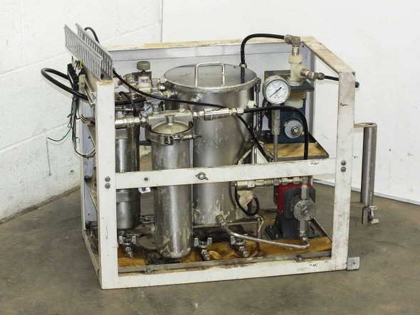 Lacquer dispensing system overall front-left view showing stainless steel containers, plumbing manifold, and white painted steel frame
