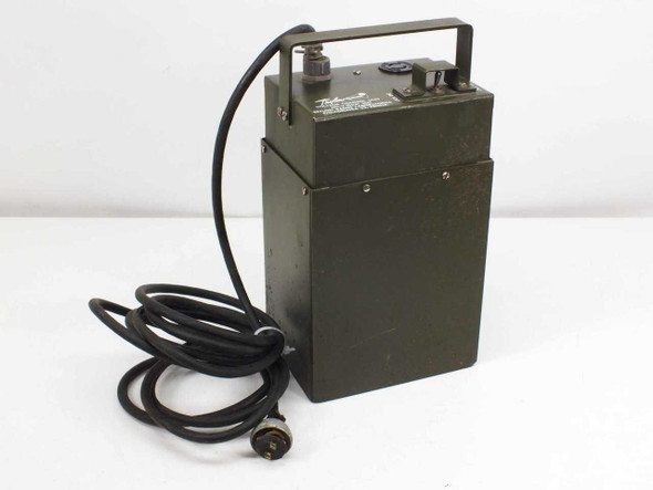 Trylon Radio Laboratories MIL-V-10537 Voltage Control Unit — front-left view showing olive drab steel enclosure, carry handle, and attached power cable with circular connector