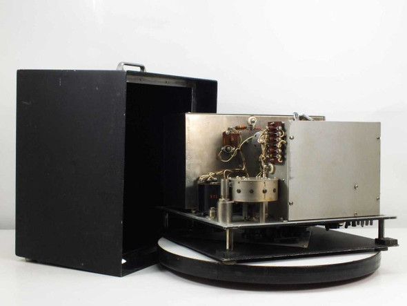 Federal Manufacturing CDF-60006-A LP-5 RF Signal Oscillator with outer case open revealing internal chassis on turntable base