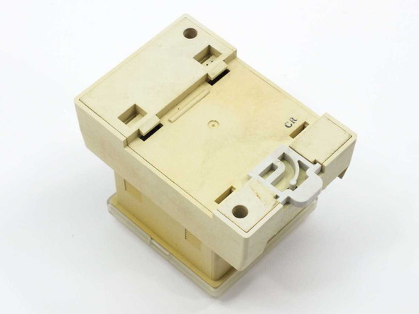 SMC PSE100-B pressure switch rear and bottom view showing DIN rail clip and plastic housing — cream colored enclosure