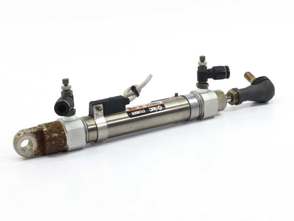 SMC CDM2C20-80 pneumatic cylinder – opposite side view showing SMC label, rust on cylinder body, push-in fittings and auto-switch