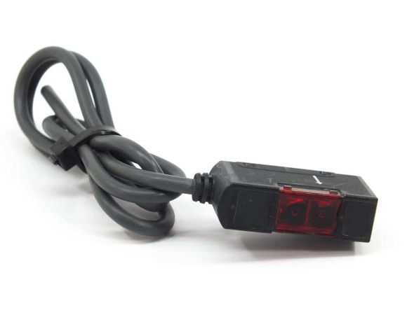 Omron E3S-AT61-L emitter – angled front view showing red lens and cable
