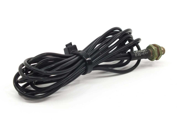 Omron E32-D11 optical fiber sensor cable coiled, full length view showing black lead and threaded tip