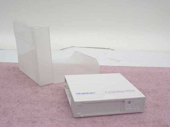 Quantum CompacTape IIIXT DLT III XT cartridge shown flat with protective plastic case standing upright nearby