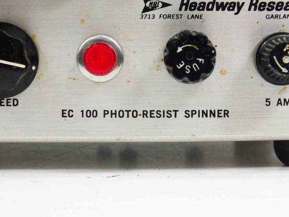Headway Research EC100A front panel close-up showing red indicator light, speed knob, EC 100 Photo-Resist Spinner label, fuse holder, and 5 AMP rating