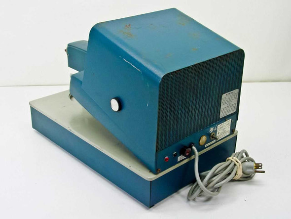 Macbeth TD-102 QuantaLog Densitometer — rear/side view showing ventilation grille, power cord, and indicator lights