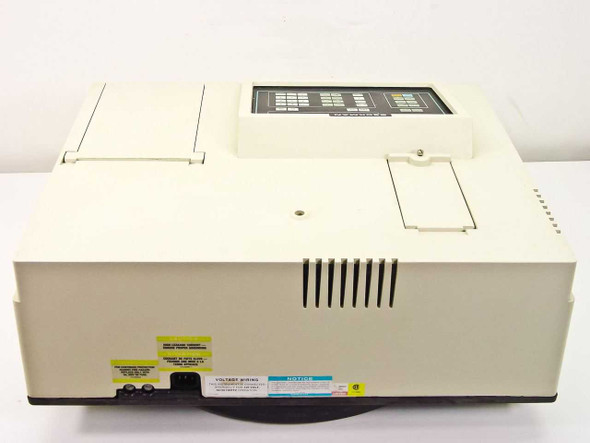Beckman DU-65 spectrophotometer right-side and rear view showing ventilation slots and warning labels