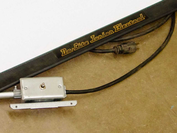 Da-Lite Junior Electrol housing end detail showing gold lettering, toggle switch control box, and power cord