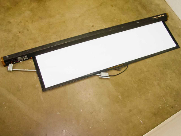 Da-Lite Junior Electrol J681-63 8ft motorized projection screen laid flat showing full screen surface and housing