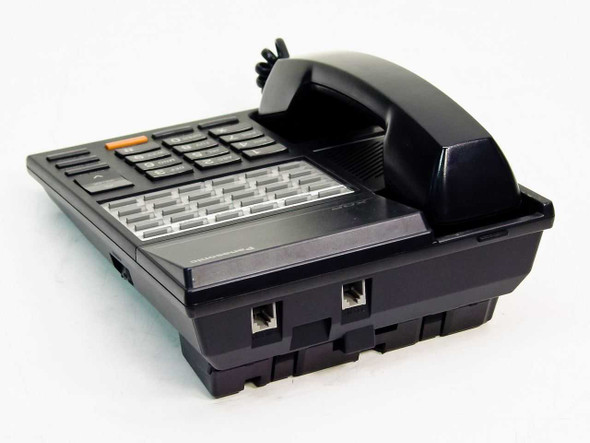 Panasonic KX-T7220 XDP phone angled rear-left view showing underside and two modular port openings