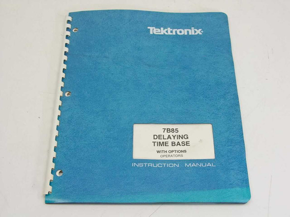 Tektronix 7B85 Delaying Time Base Instruction Manual — front cover, teal spiral-bound with title label