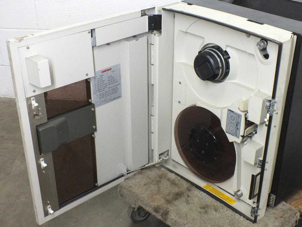 Fujitsu M2444AC tape drive – door open showing take-up reel hub and supply reel assembly inside Wiltec cabinet