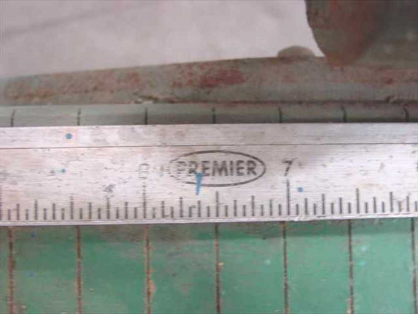 Close-up of Premier brand stamp on the integrated inch ruler of the Photo Materials Co. paper cutter