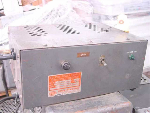 Sola Electric 28-5093 DC Power Supply front and top view showing Lamp and Power On indicators on gray metal enclosure