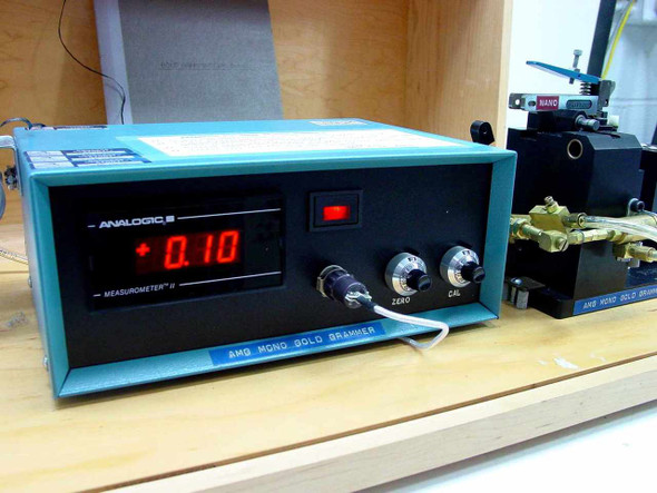 AMG Mono Gold Grammer — Analogic Measureometer II front panel showing red LED display reading +0.10, Zero and Cal knobs, and power switch