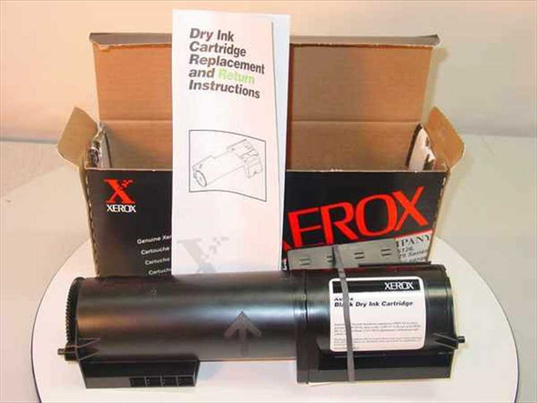 Xerox 6R708 black dry ink toner cartridge removed from box alongside dry ink cartridge replacement and return instructions booklet
