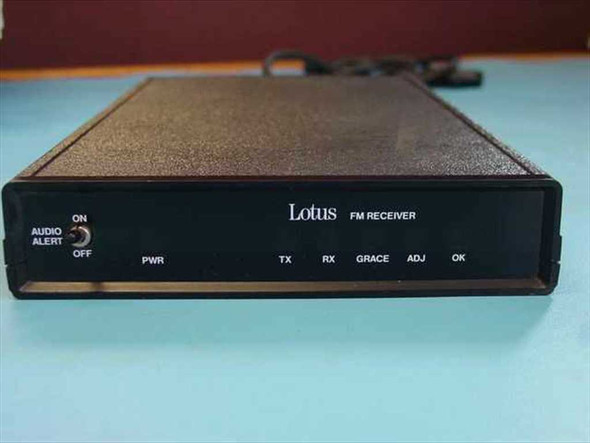 Lotus M13 FM Signal Receiver front panel showing AUDIO ALERT ON/OFF switch, PWR TX RX GRACE ADJ OK indicators, and Lotus FM Receiver branding