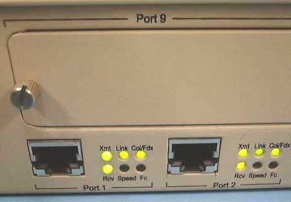 NBase NH 2012 front panel — Ports 1 and 2 RJ-45 with Xmt, Rcv, Link, Speed, Col/Fdx, Fc LED indicators lit; Port 9 expansion slot above
