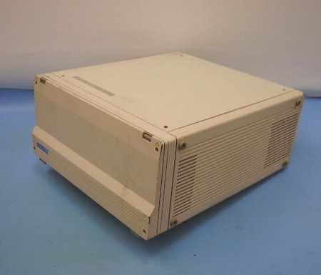 Tekelec TE713 Chameleon 32 right-side and top view showing cream-colored enclosure with ventilation slots