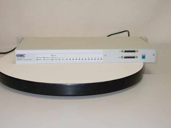 SMC Elite 3812TP 10BASE-T concentrator – front panel view showing SMC logo, status LEDs, and two AUI/stacking ports on right
