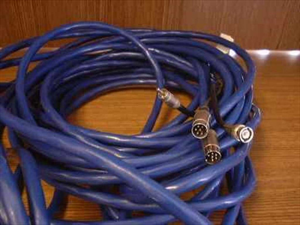 65-foot blue MIDI DIN 5-pin male to female extension cable coiled on wooden surface, showing both male and female DIN connectors at ends