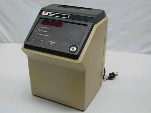 Simplex 1302 Management Terminal Calculating Time Clock – front and right side view showing beige housing, LED display panel, and power cord