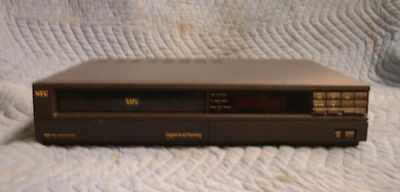 NEC PV-1300A VHS Video Cassette Recorder — front panel view showing cassette door, LED display, and channel controls