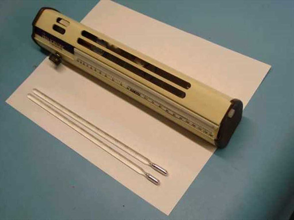 Vista Scientific 7840 Psychrometer housing laid flat with two glass thermometers displayed in front – overview