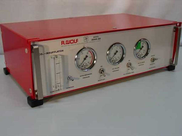 Richard Wolf 2043.50 CO2 Insufflator front-left view — red enclosure with flow control column, pressure gauges, and toggle switches