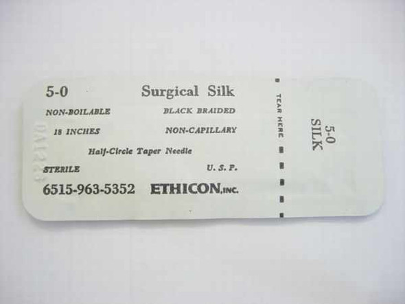 Ethicon 6515-963-5352 5-0 Surgical Silk suture packet — front label showing size, black braided non-capillary spec, 18 inches, half-circle taper needle, sterile USP markings