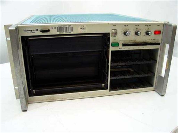 Honeywell 1858 Visicorder chart recorder front panel — rack-mount chassis showing empty plug-in module bays, front panel controls and switches, missing paper cover section