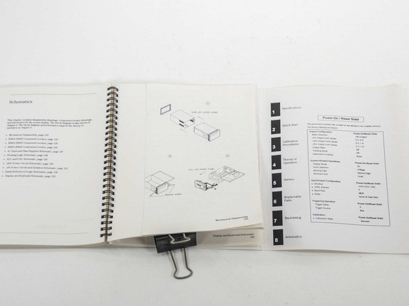 Agilent E3631A Service Guide open to schematics section, showing wiring diagrams and tabbed divider pages