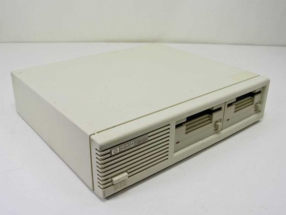 HP Hewlett-Packard 9121D dual 3.5-inch external floppy drive — front-right three-quarter view showing overall enclosure and dual drive bays