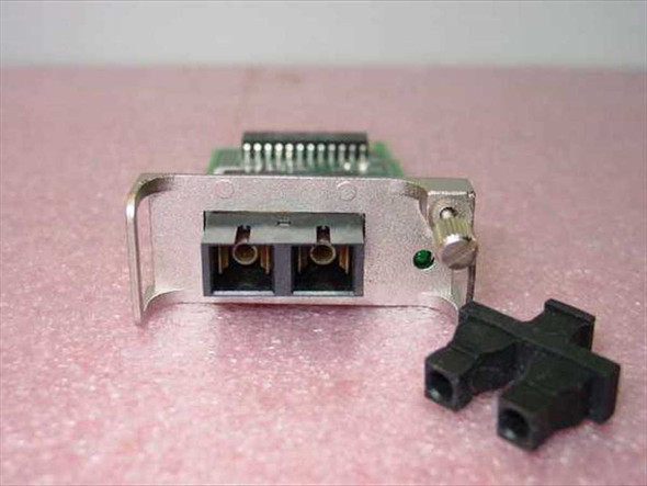 Cabletron EPIM-100FX front panel view showing dual SC fiber optic port and green LED indicator with dust cap alongside