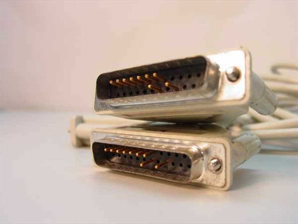 Close-up of two DB25 male connectors on the fan-out end of the aggregator cable showing gold pins