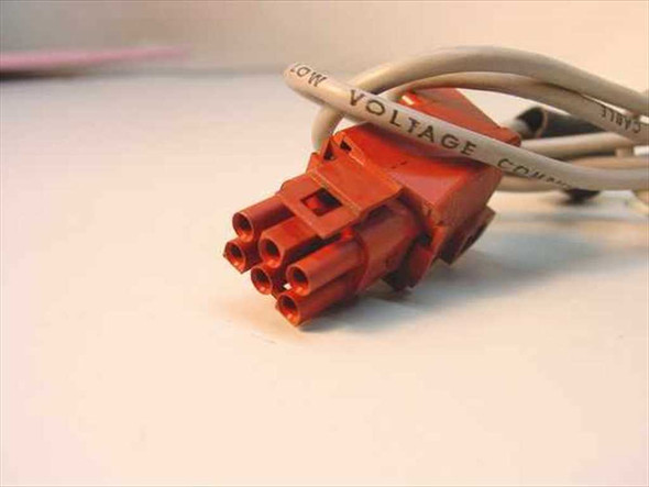 Close-up of red 6-pin proprietary POS connector end with cable jacket labeled Low Voltage Computer Cable