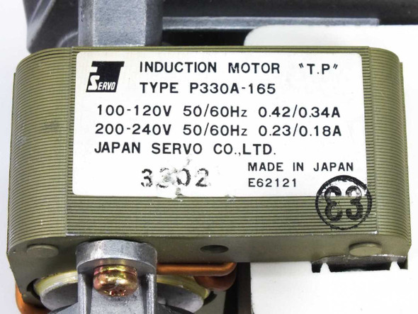 Japan Servo P330A-165 motor label closeup showing Type T.P, voltage and current ratings, Made in Japan